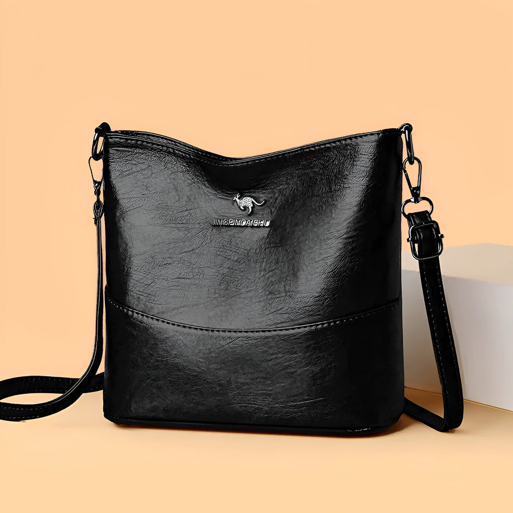 Women's solid colour soft leather shoulder bag with sewing line in black, ginger yellow, or wine red