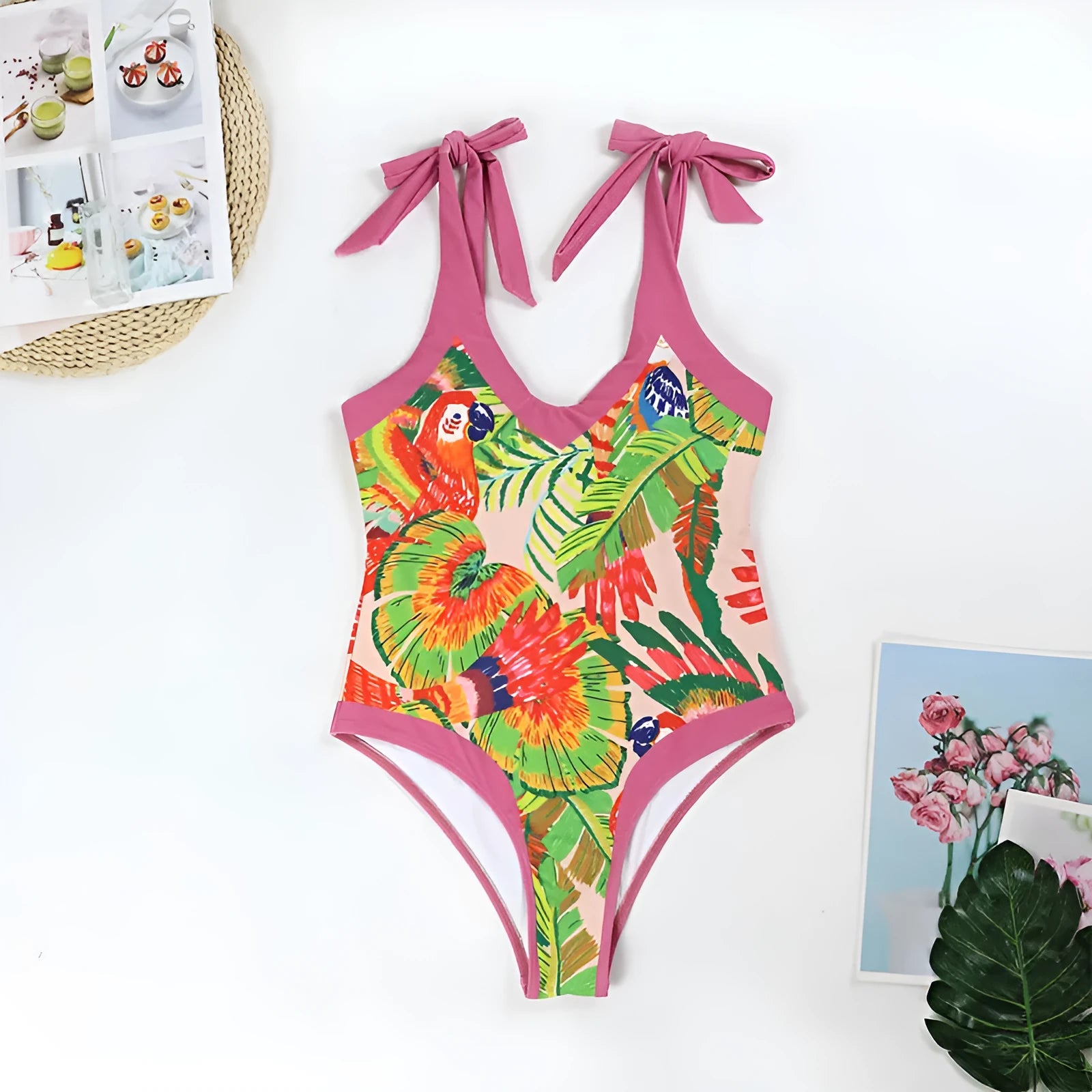 Retro pink floral print women's one-piece swimsuit with V-neck and attached thin skirt.