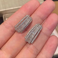 Geometric stud earrings with white gold colour finish and zircon inlaid decoration