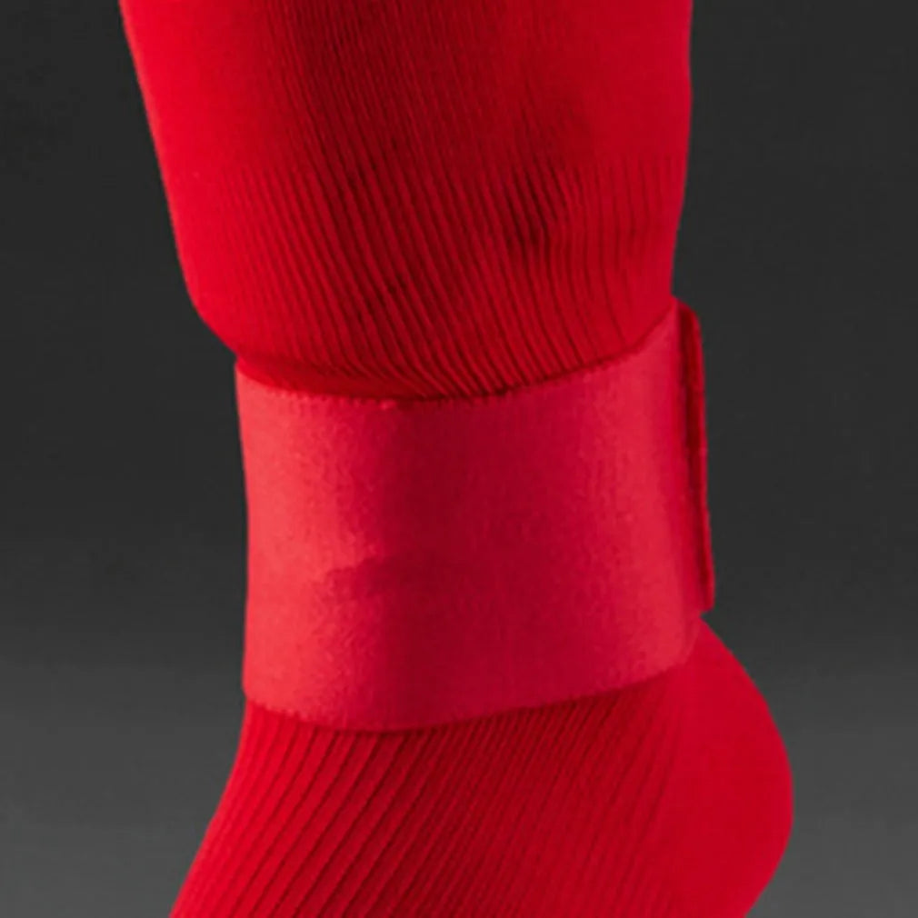 Elastic rubber strap for securing football shin guards, shown in blue colour.