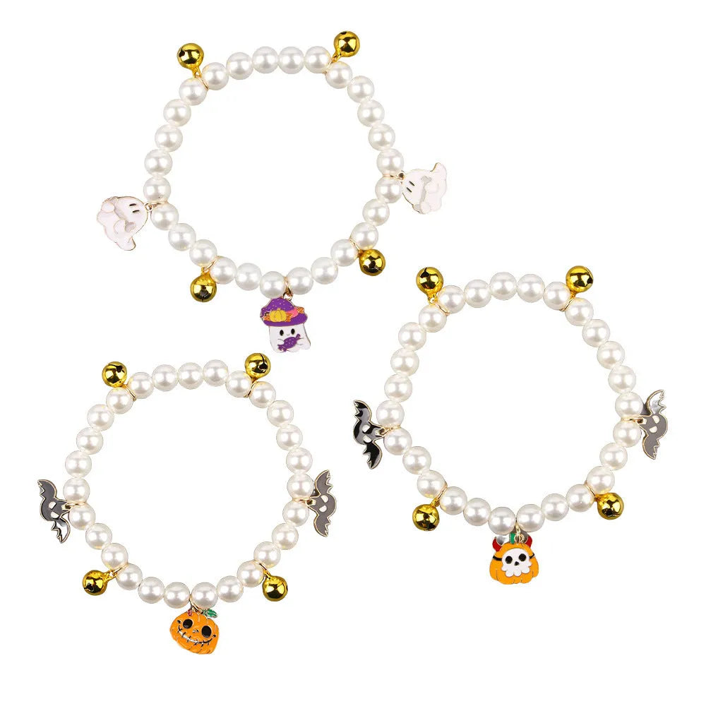 Halloween cat collar with simulated pearl necklace and a central pumpkin charm decoration.