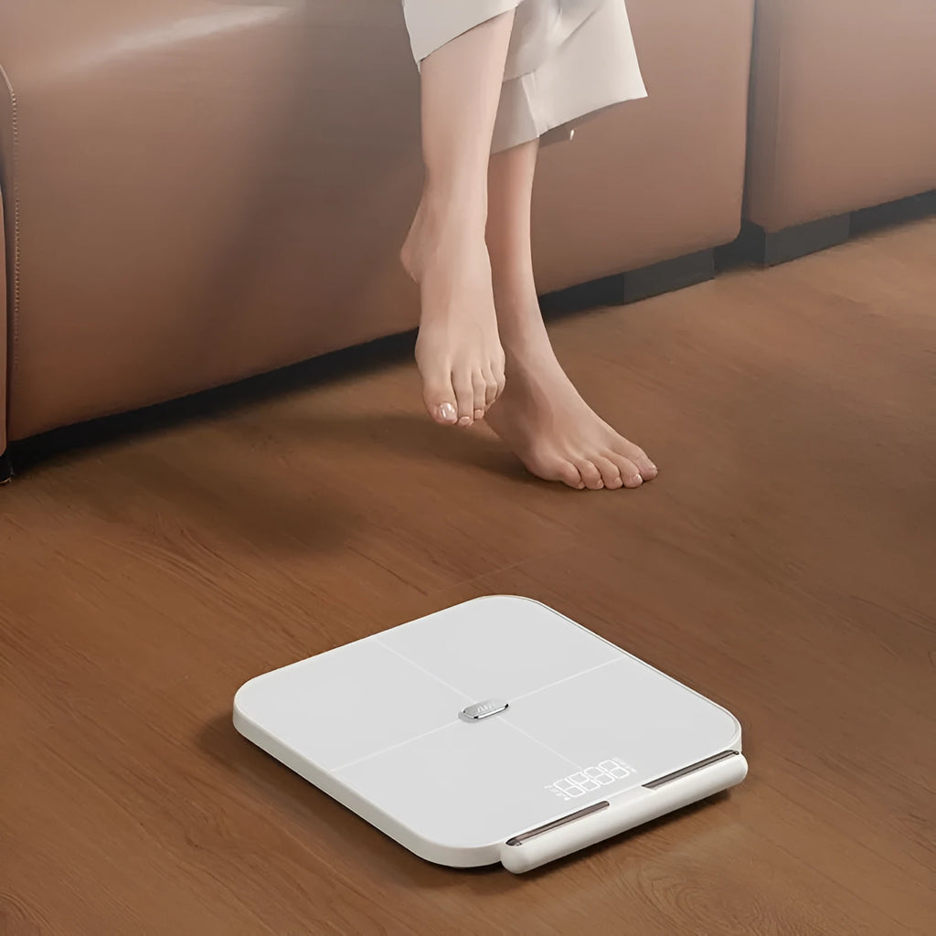 White smart body fat scale with eight electrodes and tempered glass platform measuring 30x30cm