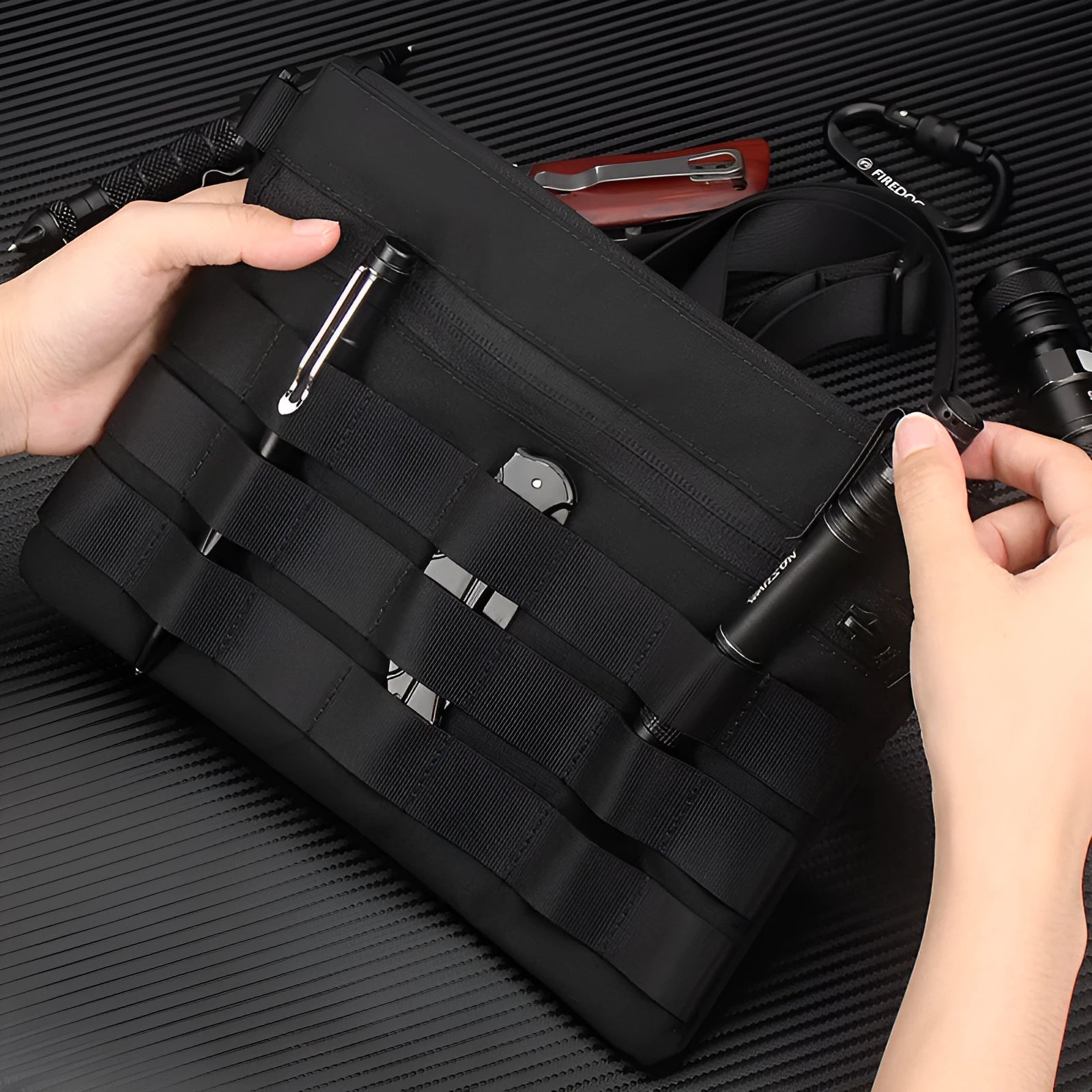 Black oxford cloth outdoor kit bag measuring 18cm by 3.5cm