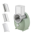 White electric vegetable slicer with suction base and multiple blades for cutting potatoes and carrots