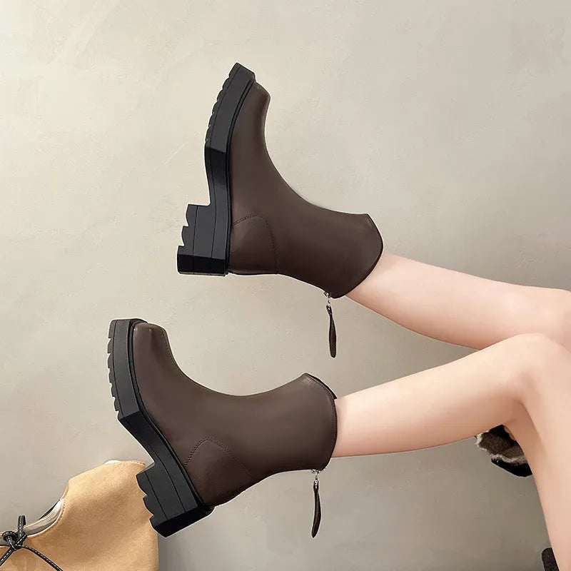 Black square toe women's platform Martin boots with a high heel and back zipper.