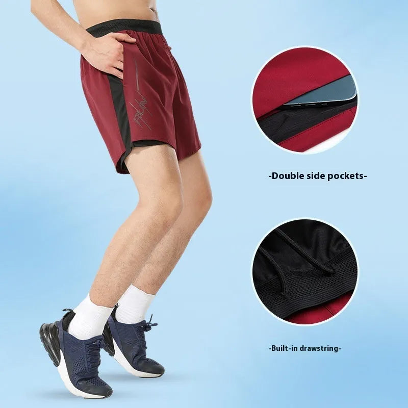 Men's solid colour polyester basketball shorts with a low-waist design on a neutral background.