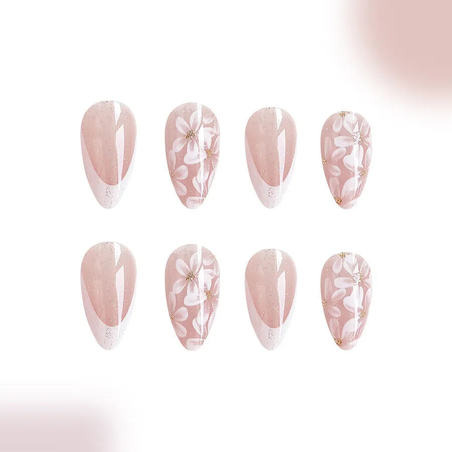 Short almond shaped French style artificial nails with glitter and flower pattern in colour C625