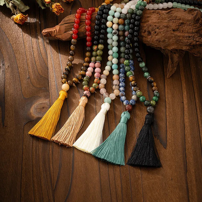 Vintage bohemian style beaded chain necklace with geometric round beads and tassel details