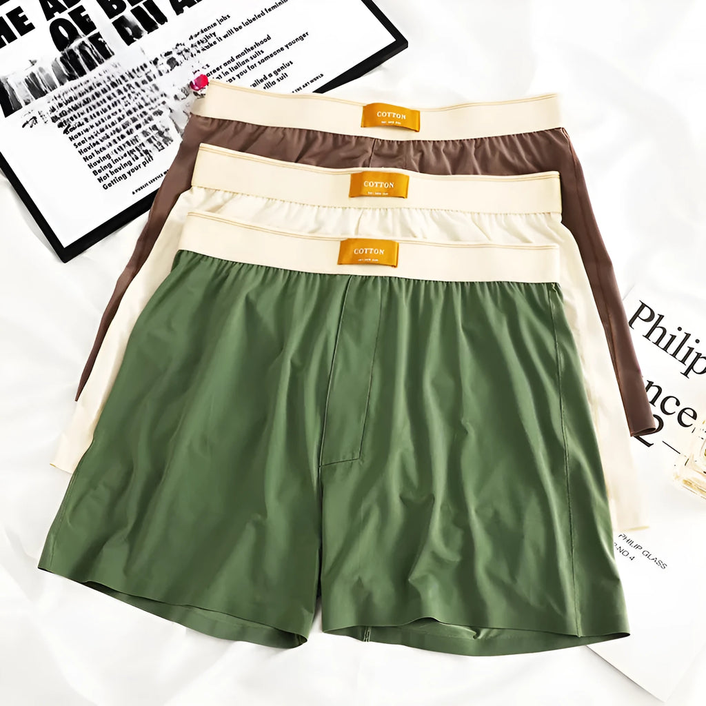 Three pairs of solid colour men's ice silk boxer shorts in loose fit mid-waist design
