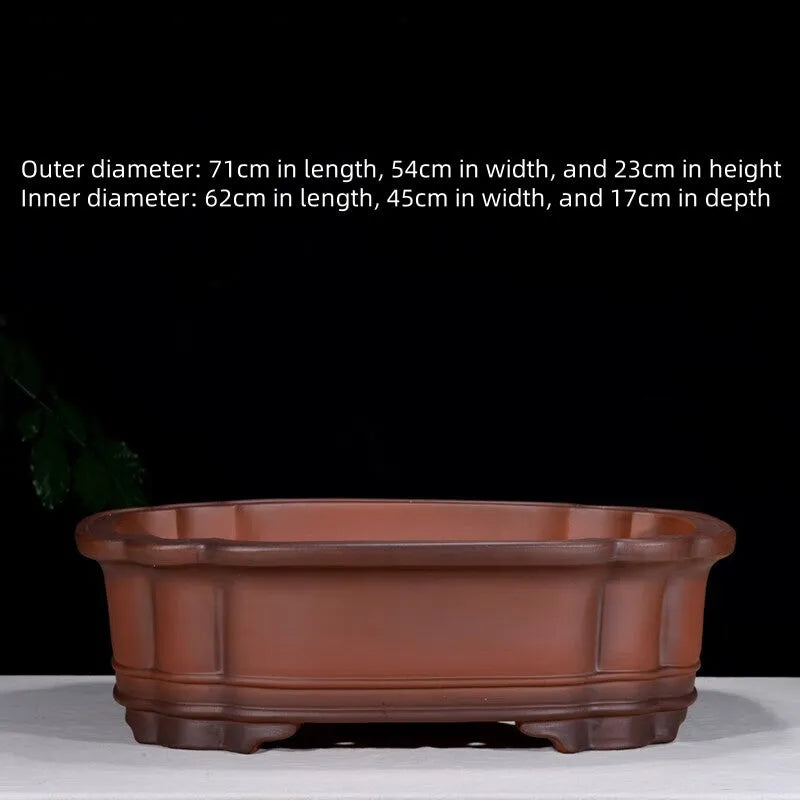 Antique-style purple clay flowerpot with Chinese decorative motifs showing tree stump, pine, cypress, pomegranate, golden marble, antique jade belt, and crabapple designs