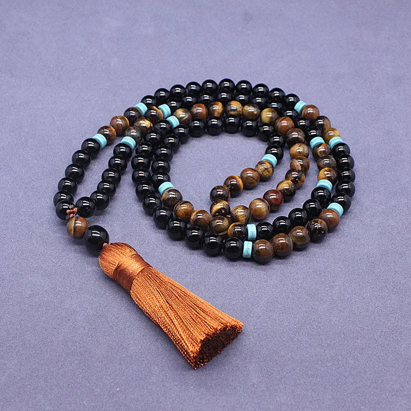 Geometric agate jewellery set with black bracelet and tiger-eye necklace