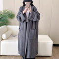 Loose hooded acrylic cardigan coat with extended length and raglan sleeves