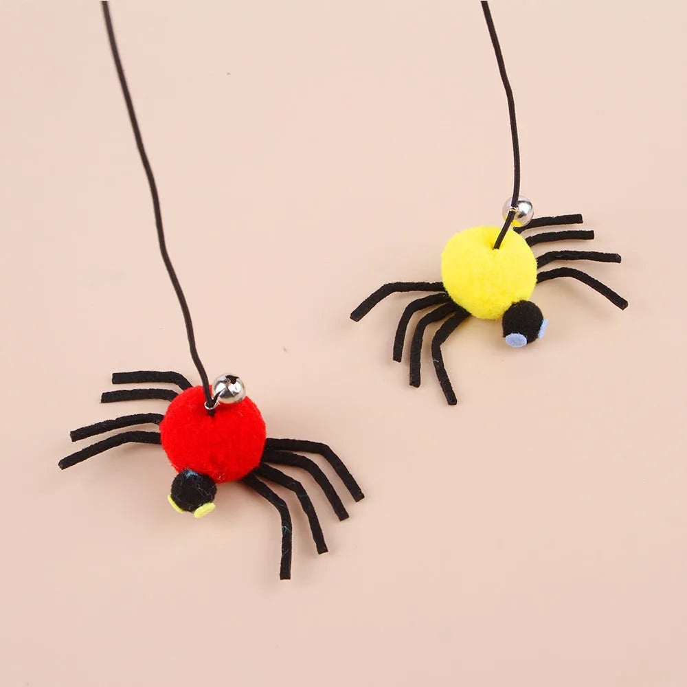 Red and yellow hanging door cat toy with swinging elastic rope, feather, and bell attachments