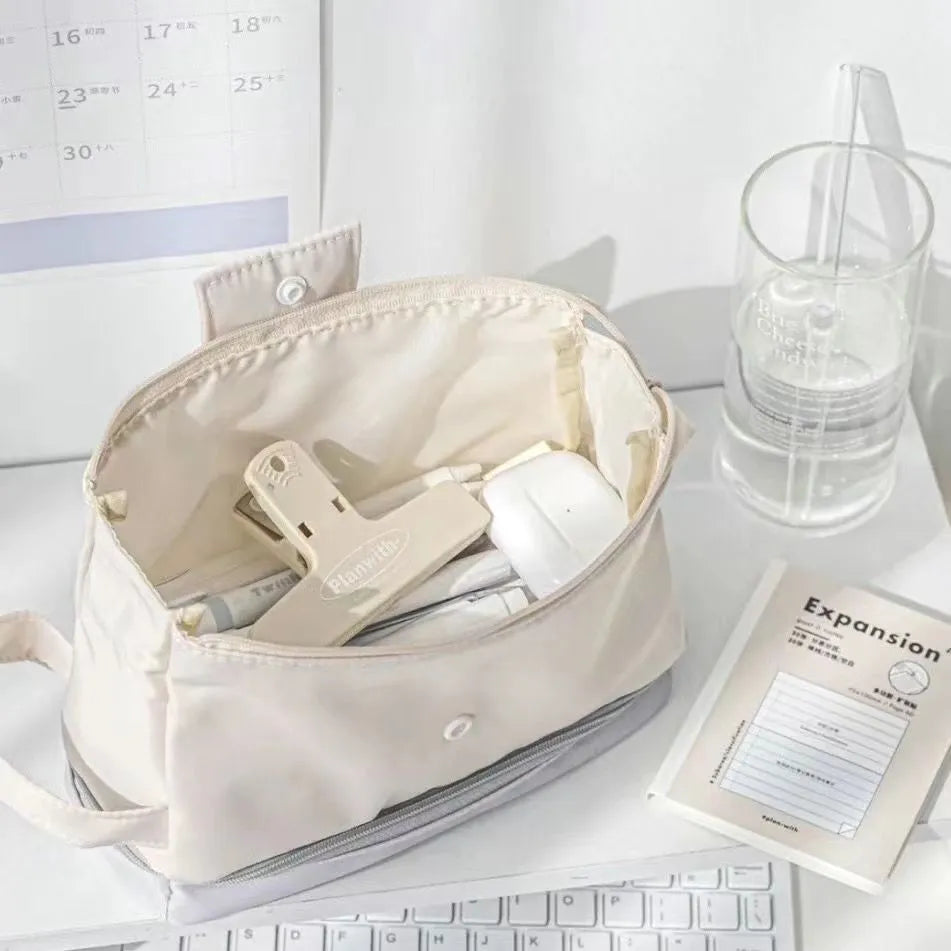 Polyester folding double-layer pencil case in dark blue, blue, and cream white colours.
