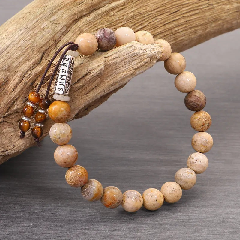 Wood colour stone bead bracelet with handmade construction on wrist