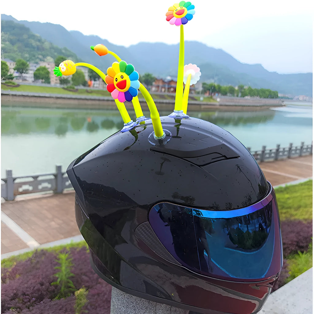 Yellow silicone sunflower helmet decoration with a suction cup mount on a helmet.