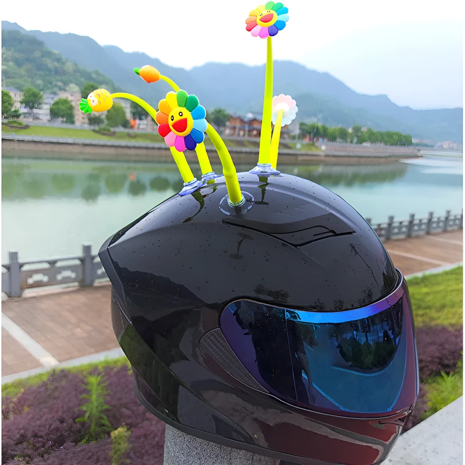 Yellow silicone sunflower helmet decoration with a suction cup mount on a helmet.