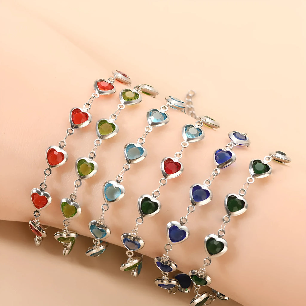 Devil's Eye Creative stainless steel heart bracelet in one of six electroplated colours on a wrist.
