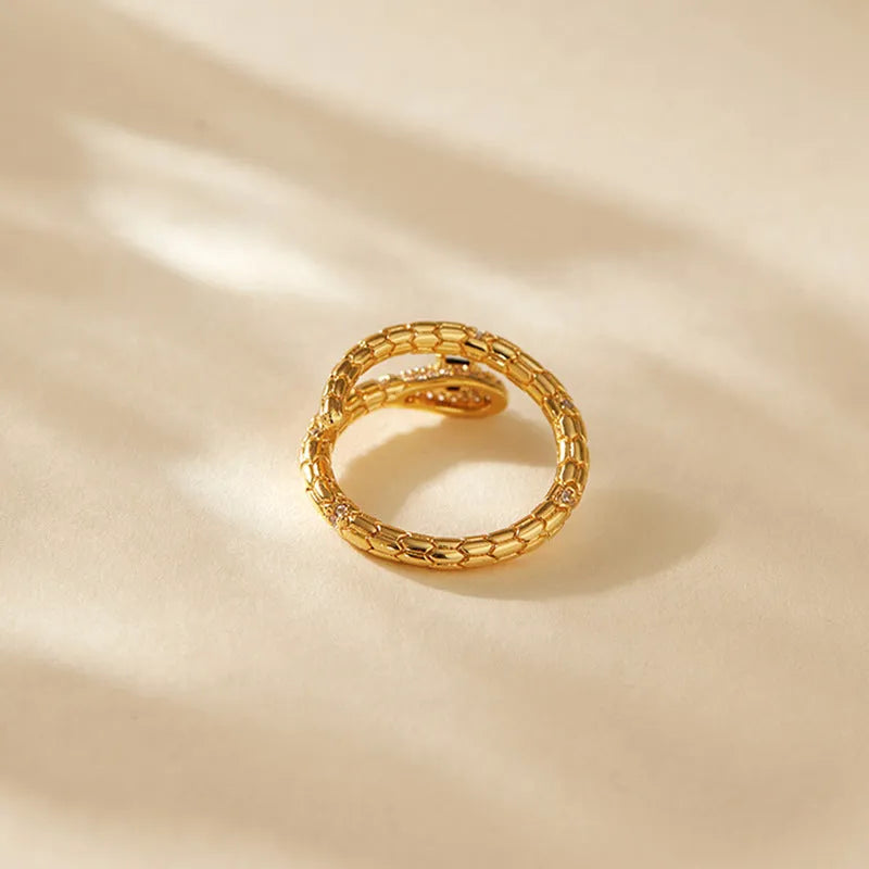 Snake-shaped adjustable finger ring with gold colour finish and detailed animal design
