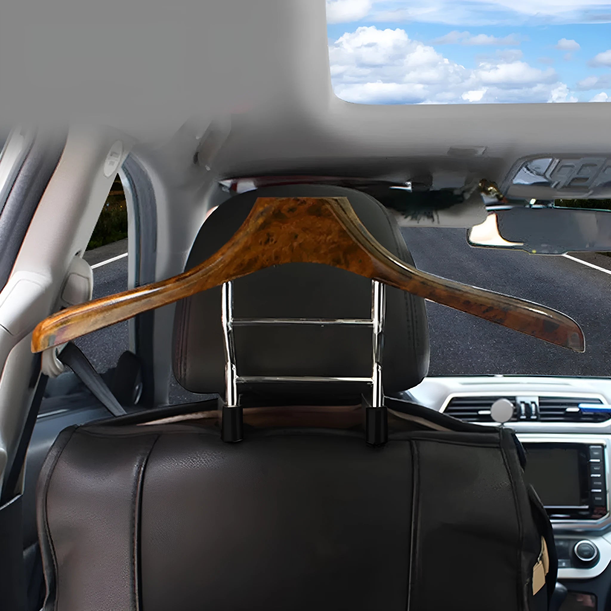 Wood yellow stainless steel car mounted clothes hanger for suits and coats on a chair back.