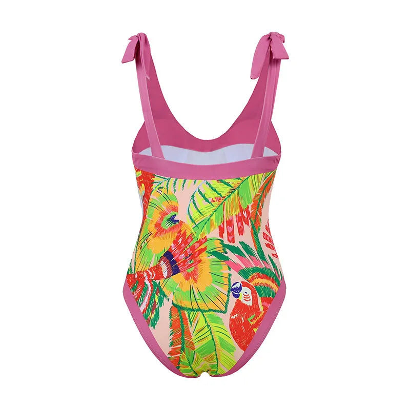 Retro pink floral print women's one-piece swimsuit with V-neck and attached thin skirt.