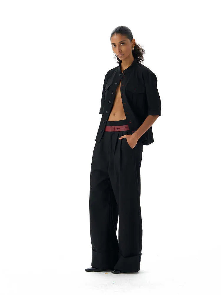 Black handmade half-sleeve hunting shirt with a shirt collar and loose fit on a mannequin.