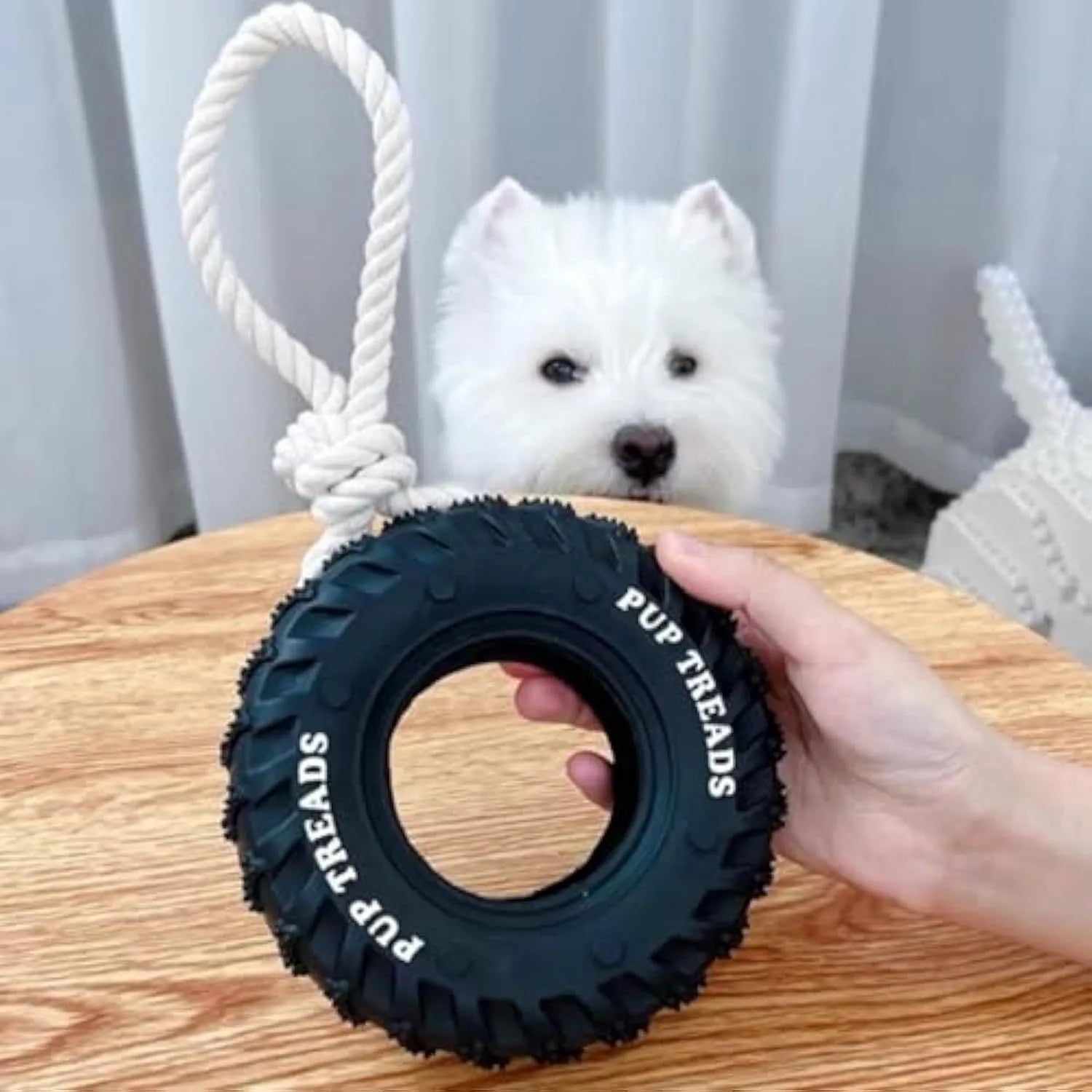 Black natural rubber dog chew toy shaped like a tire with rope, 35x16cm, for large aggressive chewers