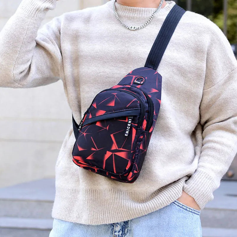 Men's blue Oxford cloth crossbody sling bag with an earphone hole and zipper, shown in a square vertical shape.