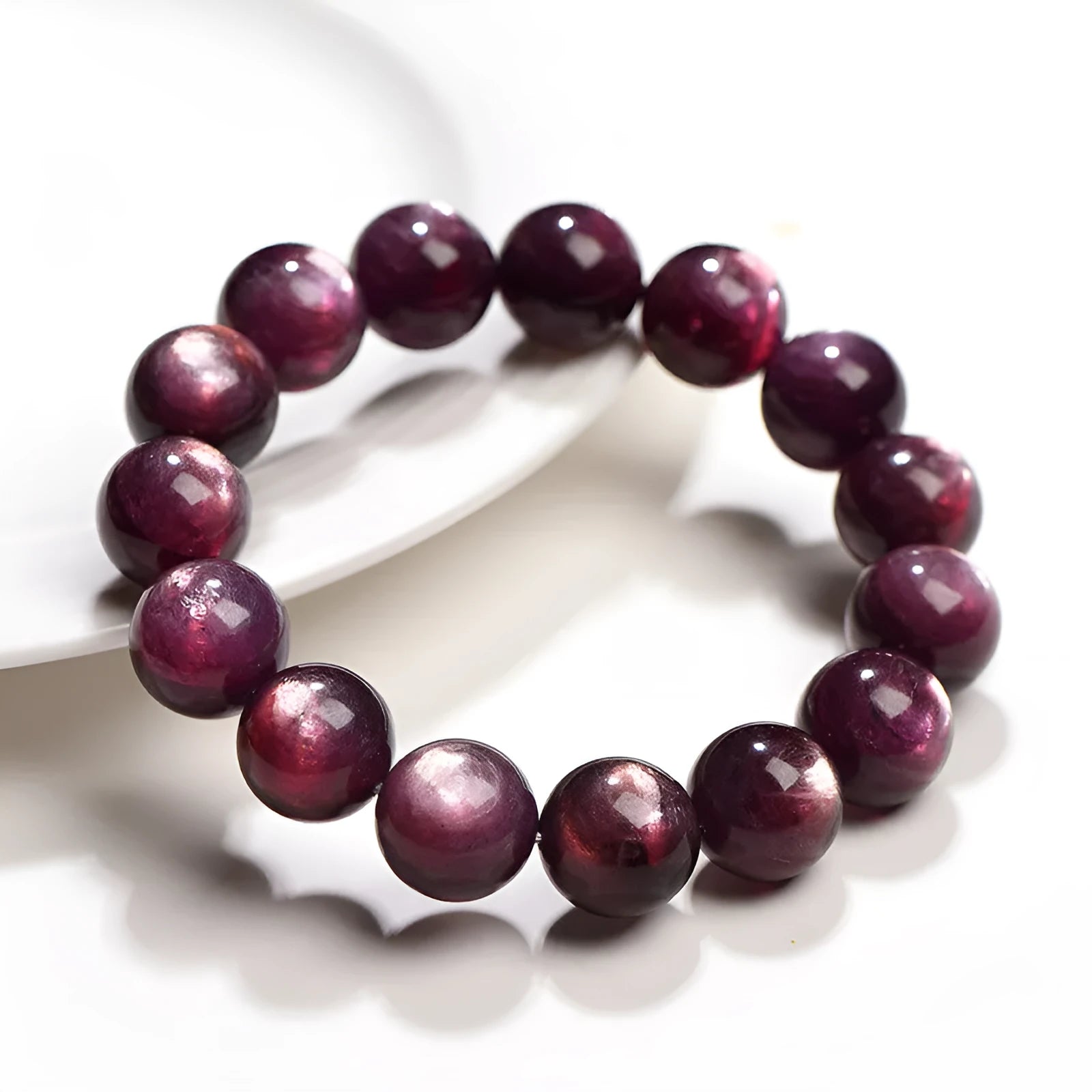 Purple lepidolite crystal bracelet with round polished beads showing multiple size options