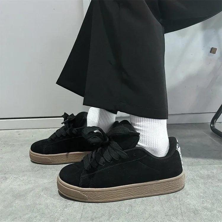 Black retro low-top sneakers with waterproof platform, round toe, and lace-up closure for men and women