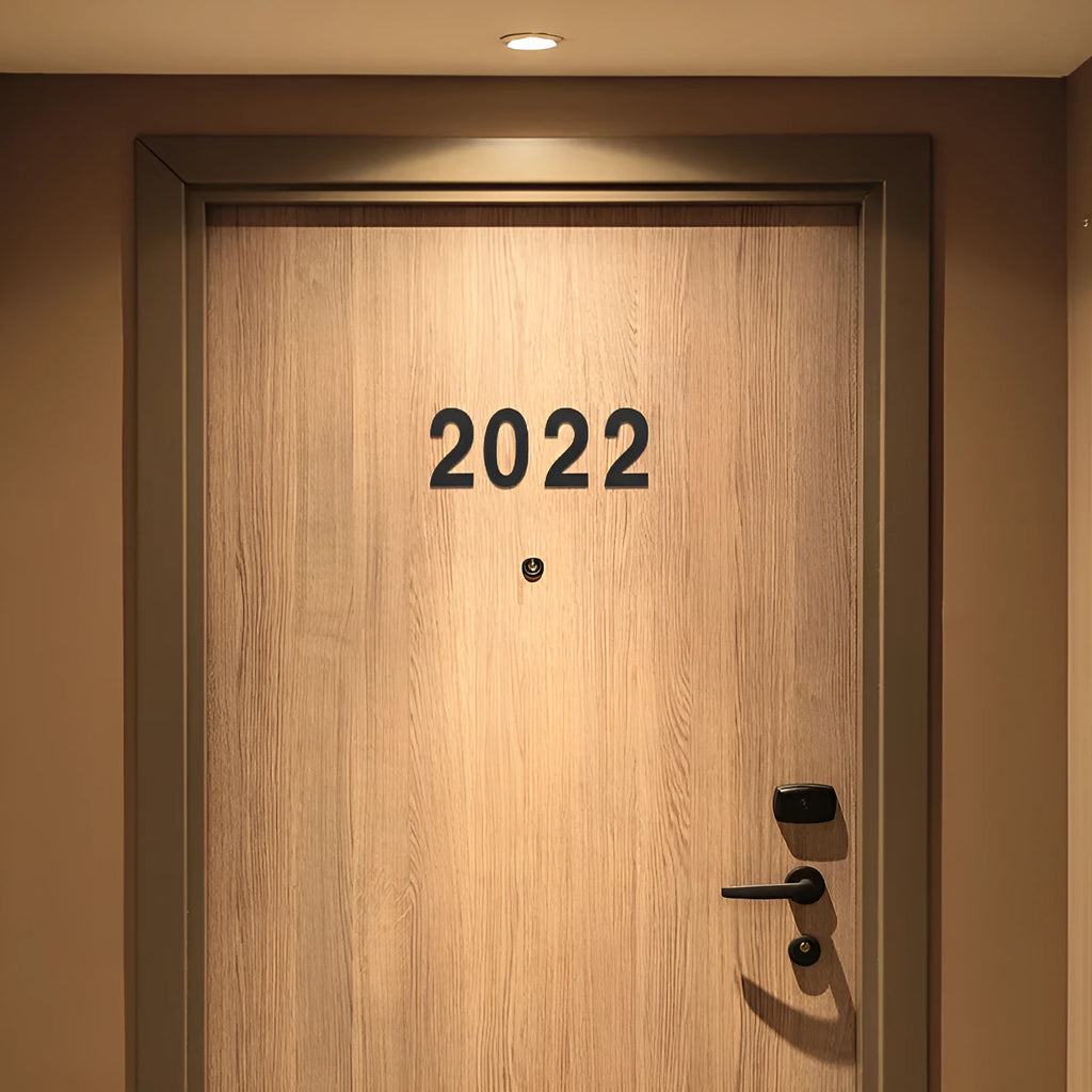 Black stainless steel adhesive house number sticker, 7.5cm tall, with raised digital font.