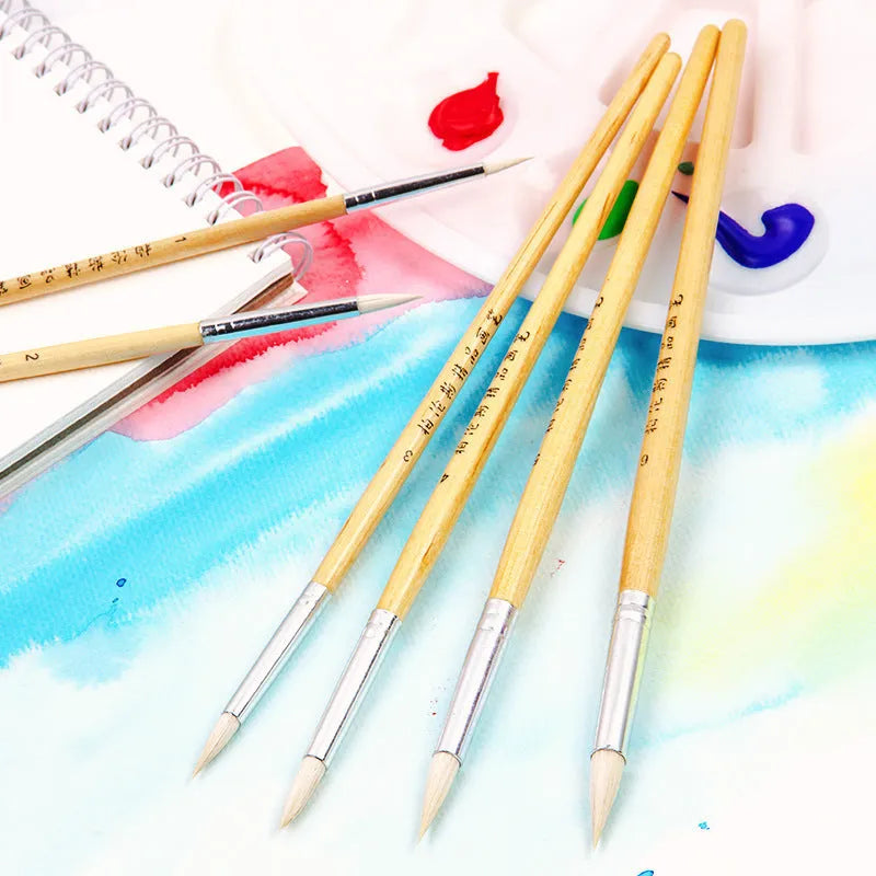 Six wooden-handled pointed wool line pen brushes arranged together.