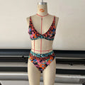 Women's floral print high-waist bikini set in polyester for swimming.