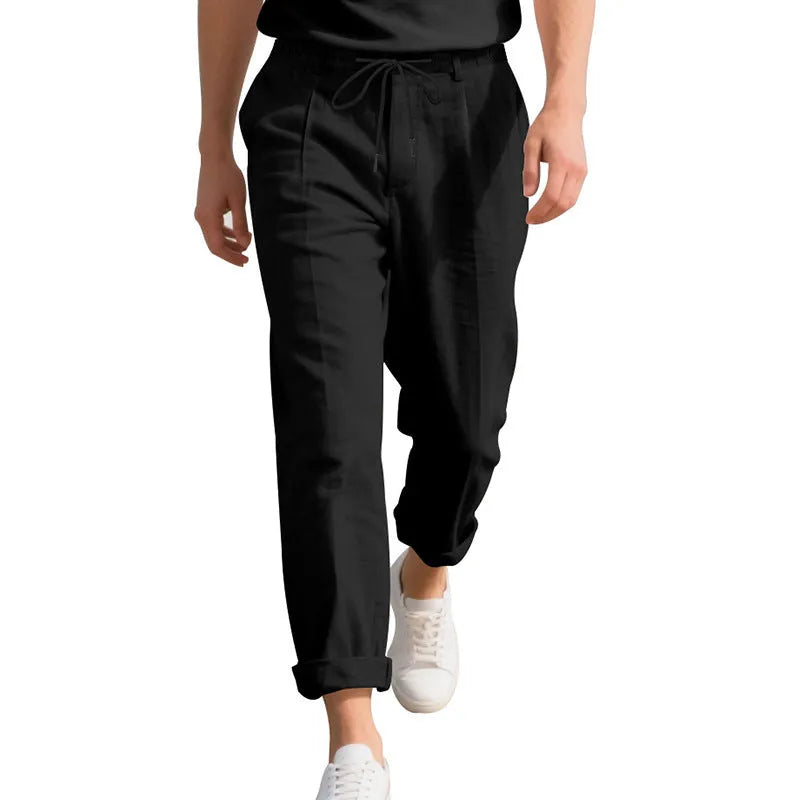 Men's linen casual trousers in light khaki colour with loose straight-leg fit and drawstring waist