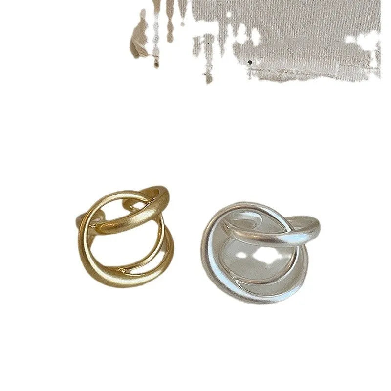 3D interlaced geometric open ring for women in matte metal with gold electroplating