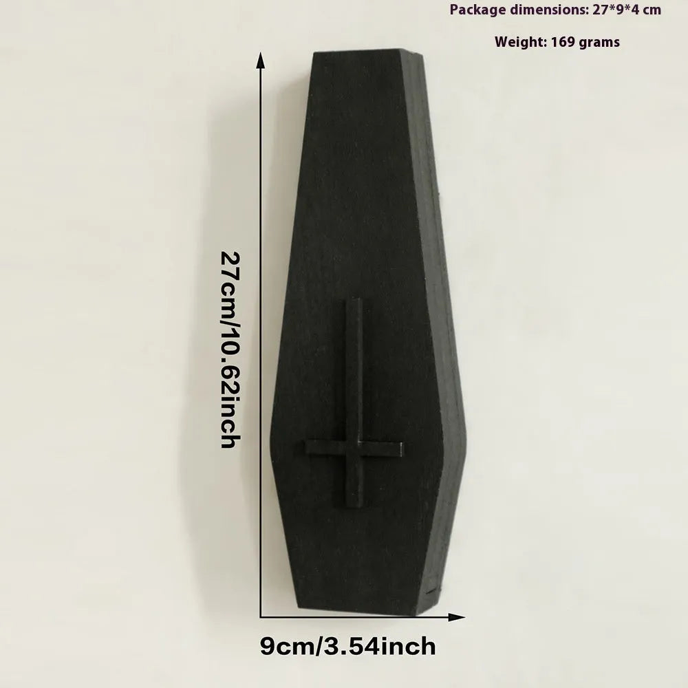 Black cross-shaped wooden wall vase shelf with a compact 27 cm ledge for holding a small vase or ornament