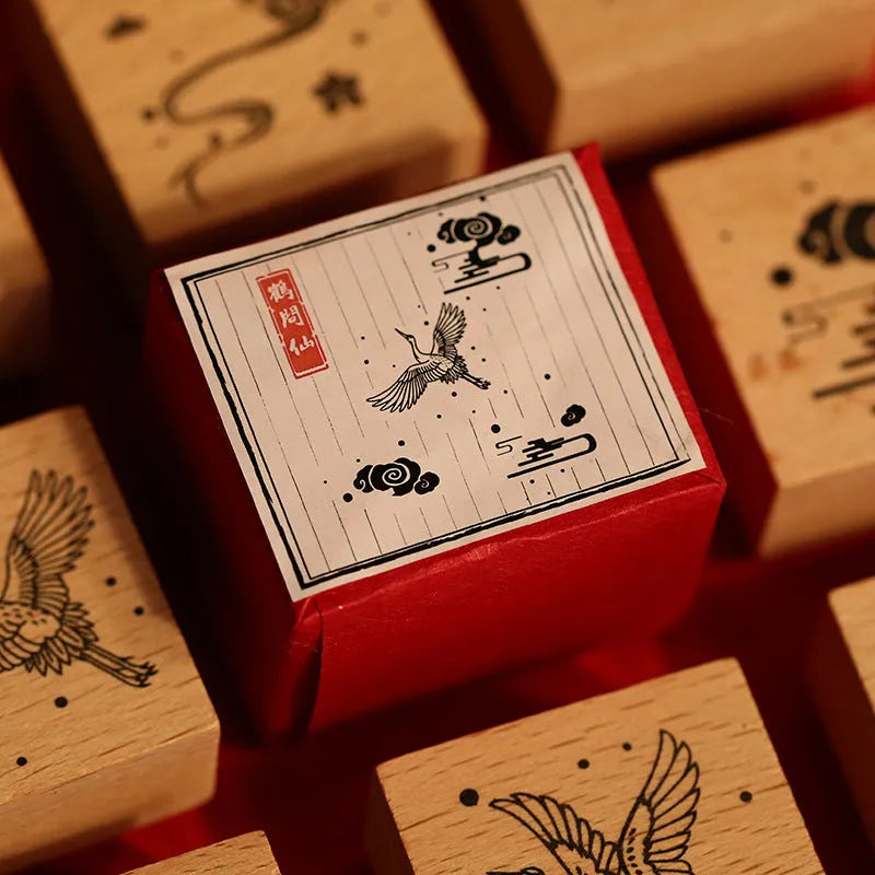 Mr. Paper wooden stamp set with four crane designs on a white background