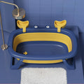 Blue foldable portable pet tub for washing a small dog or cat.