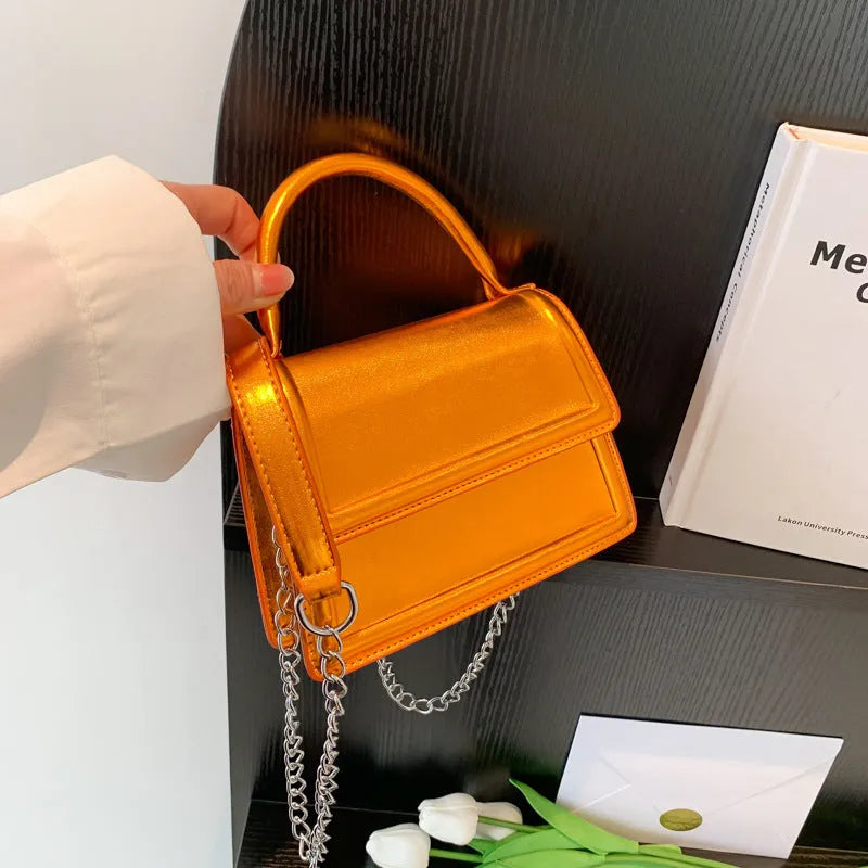 Retro square crossbody bag in PU material showing sewing line detail and crossbody strap