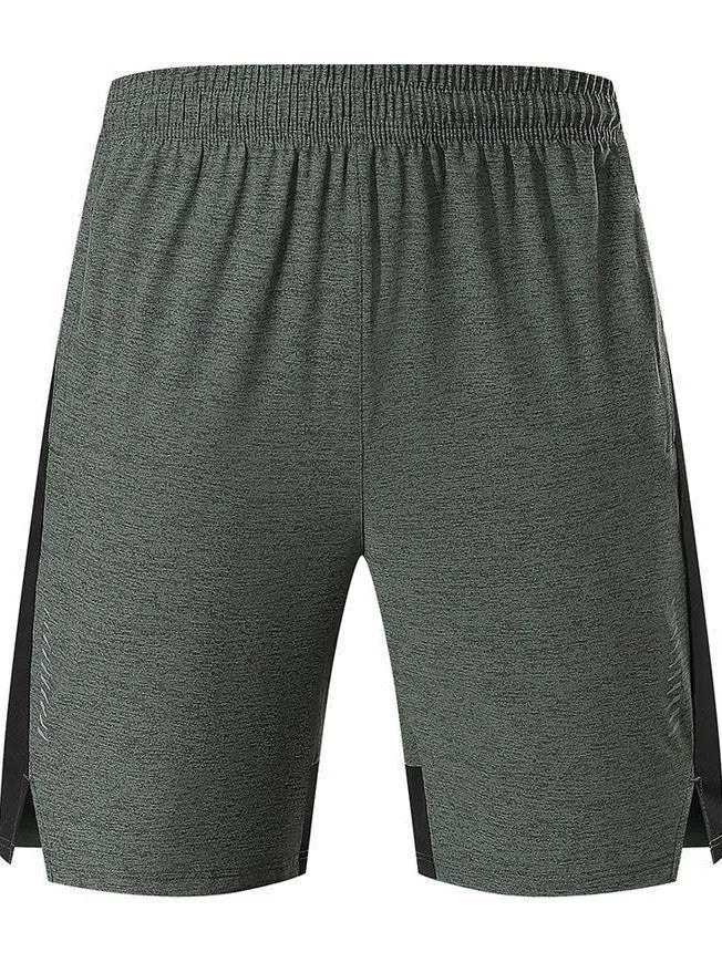Man wearing forest green five-point spandex casual shorts with a mid waist.
