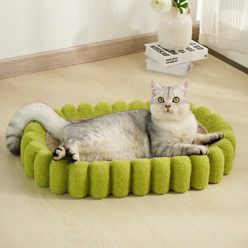 Green oval-shaped cat scratch pad and lounge bed made from textured sisal fabric.