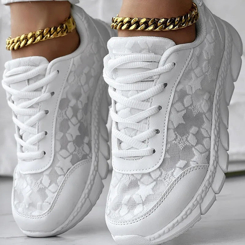 Women's casual canvas running shoes in white with a round toe, flat heel, and soft sole.