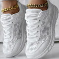 Women's casual canvas running shoes in white with a round toe, flat heel, and soft sole.