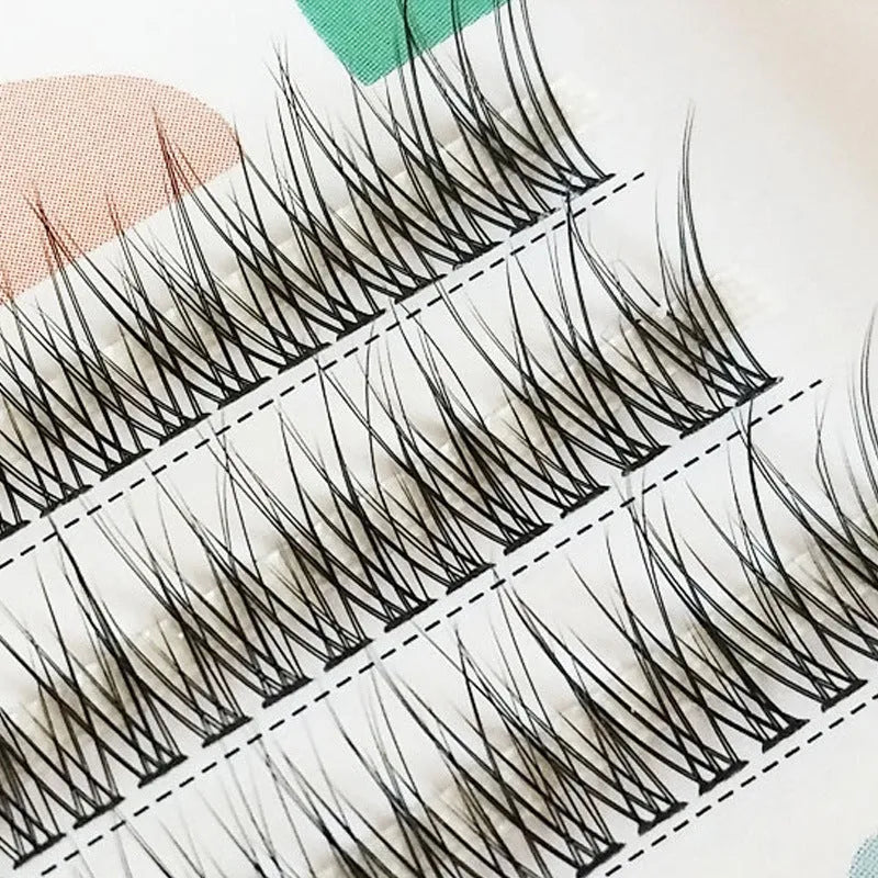 Black V-shaped fairy fishtail false eyelashes showing graduated volume pattern and thick 10mm segment construction