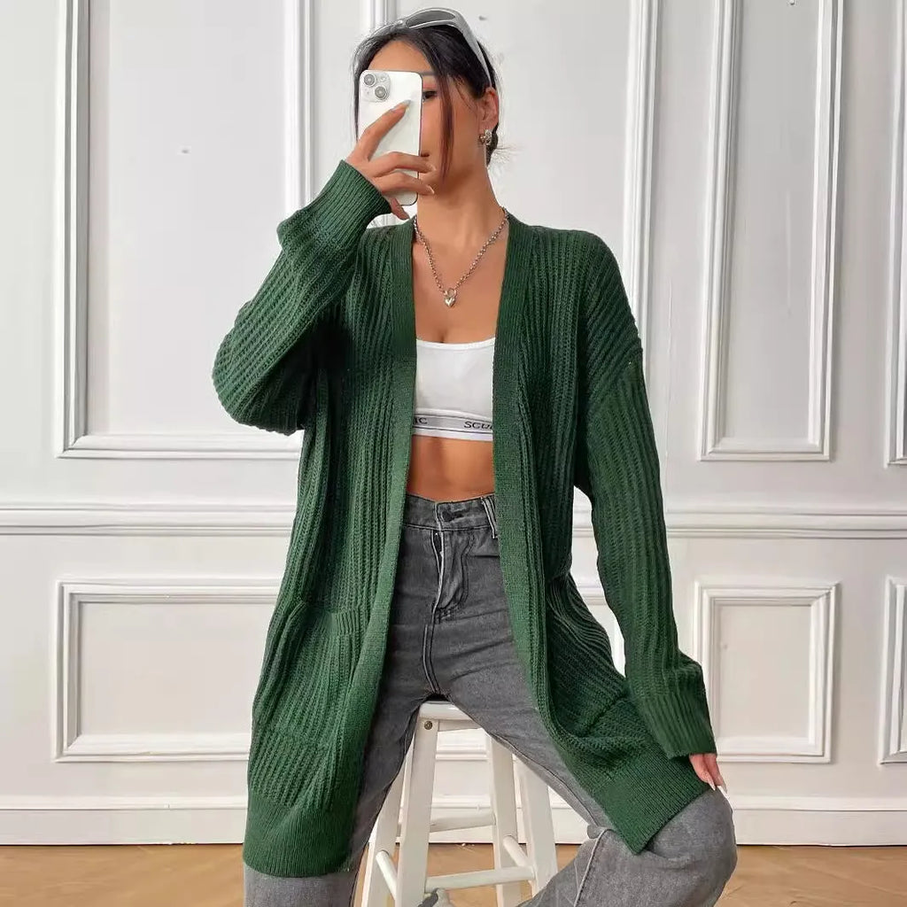 Women's double pocket cardigan in acrylic fabric showing loose fit and 65cm length