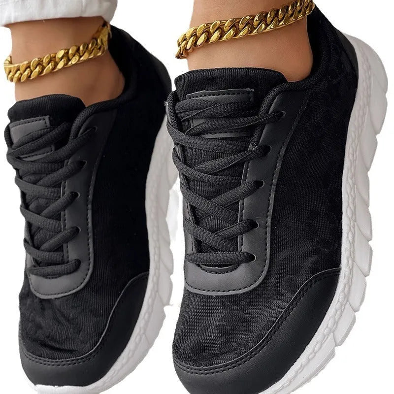 Women's casual canvas running shoes in white with a round toe, flat heel, and soft sole.