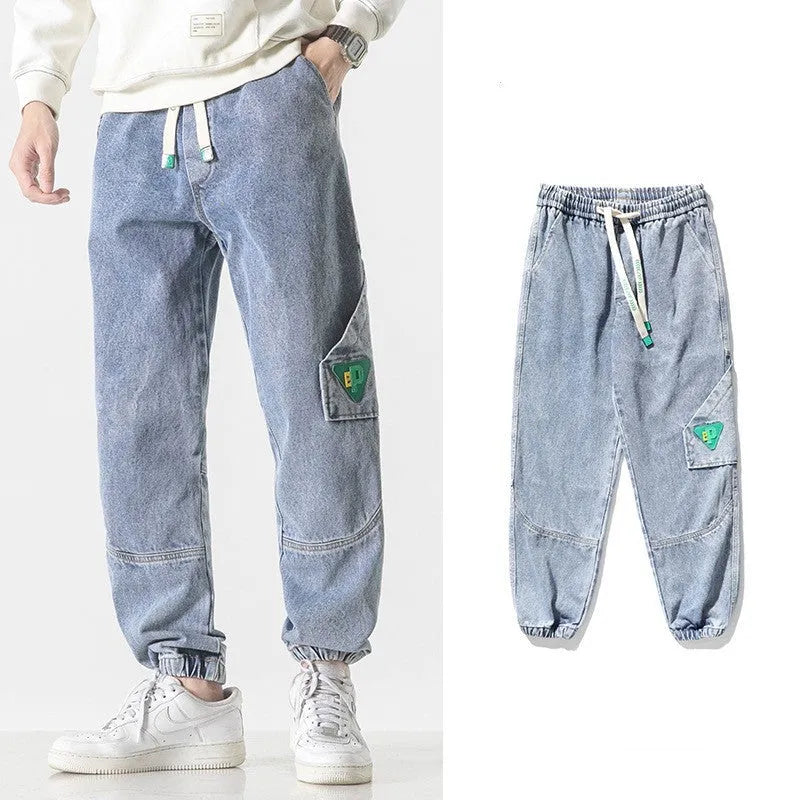 Men's cotton loose-fit tapered trousers in black colour showing mid-waist design and tapered leg silhouette
