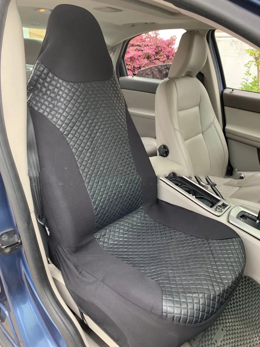 Black quilted automotive seat cover with plastic hook fasteners