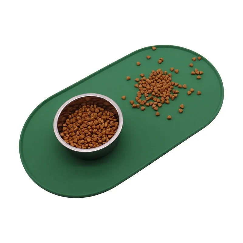Silicone waterproof cat feeding placemat showing green colour option beneath pet food and water bowls