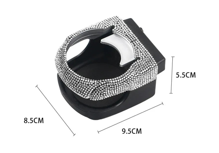 White rhinestone cup holder bracket clipped onto a car air vent